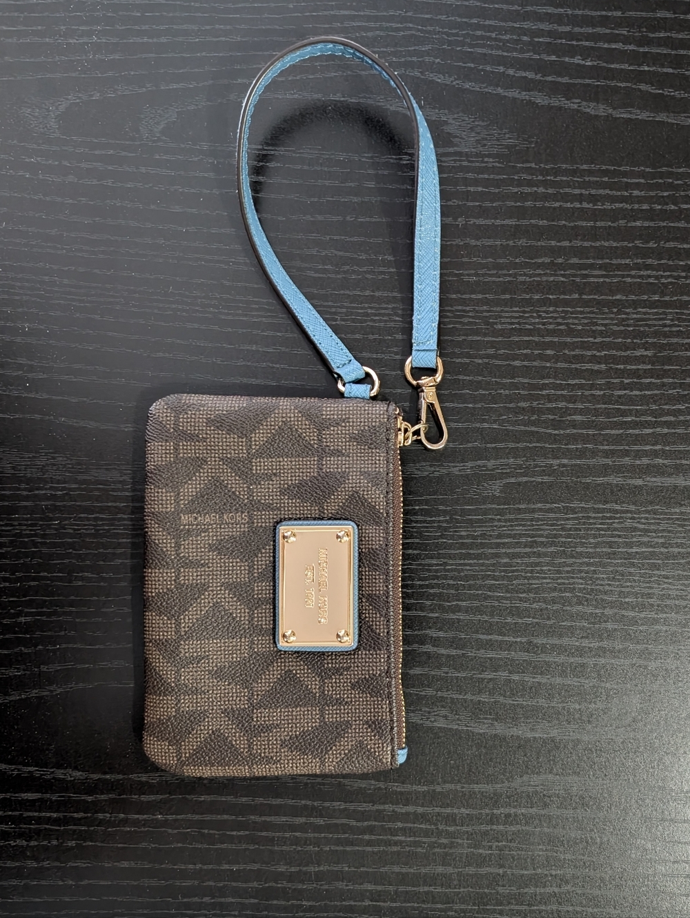 Michael Kors Brown Monogram Wristlet with Light Blue Strap